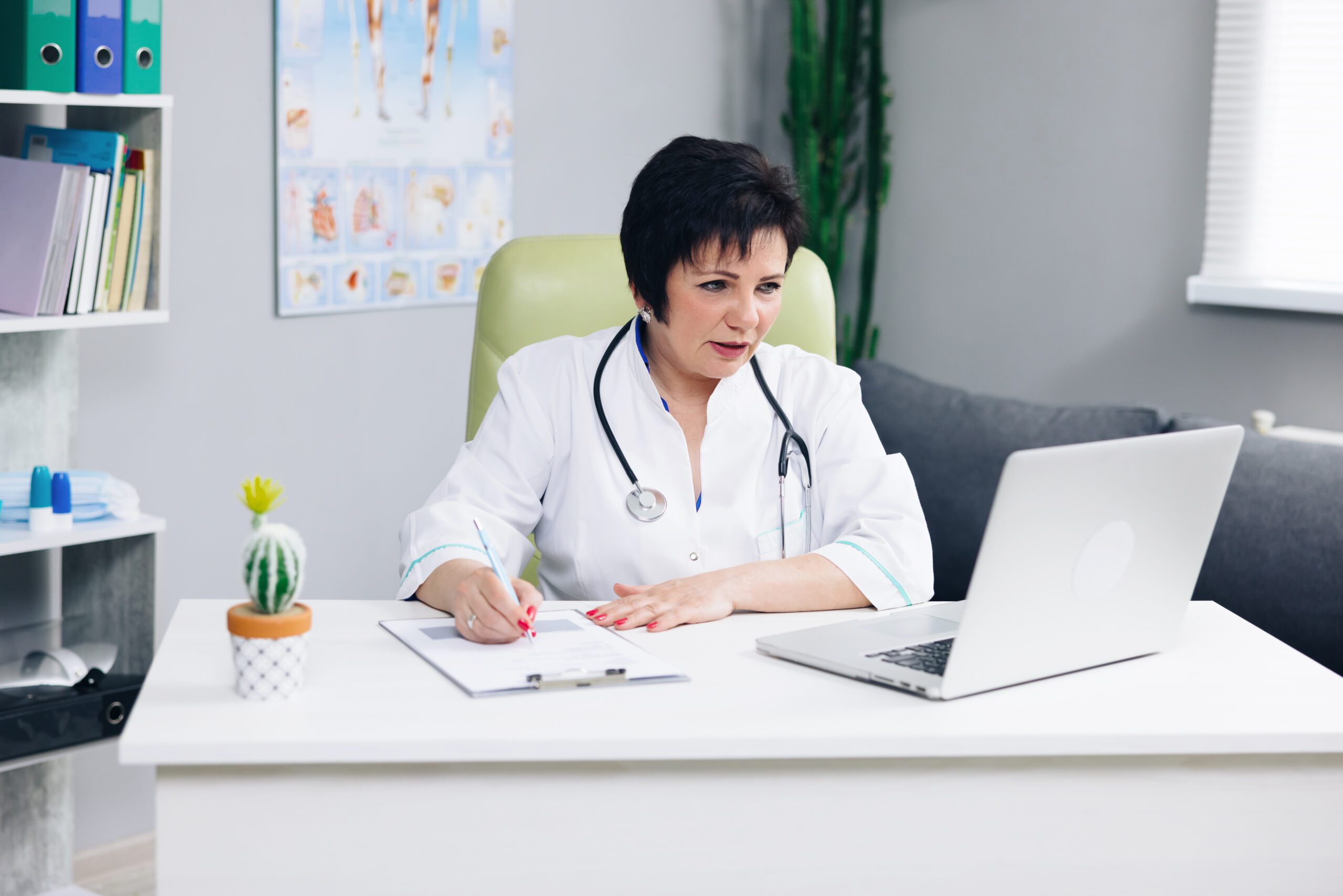Female doctor talk with patient make telemedicine online webcam video call. Woman therapist videoconferencing on computer in remote telemedicine laptop virtual chat. Telehealth concept.